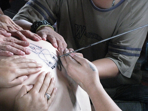 Thailand has a Buddhist tradition of getting tattoos with symbols of 